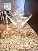 Two martini glasses showing logo and overall design