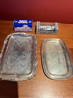 Overview of both trays and two napkin-ring boxes