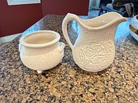 Pitcher and planter side by side showing exterior texture and design