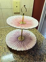 Full view of assembled two-tier serving tray showing floral design and colors