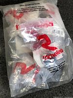 Factory-sealed Richelieu bag containing chrome knobs