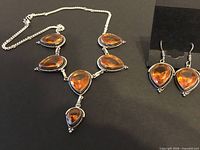 Necklace and earrings set showing layout and design