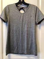 Front view of heather grey short sleeve T-shirt on hanger