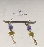 Full view of earrings on Cosmic Child card