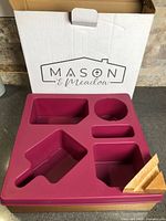 Tray in front of branded box showing silicone top with compartments