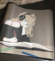 Full view of desk mat showing girl with headphones drawing