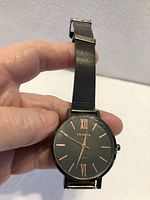 Front view of Geneva wristwatch showing dial and mesh band