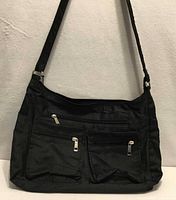 Front view showing overall purse and strap