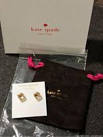Earrings on card with pouch, box and zip bag