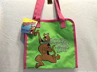 Front view of tote showing graphic and tag