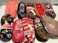 All ten pairs of assorted slippers displayed