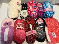 Group shot of all ten pairs of assorted slipper socks