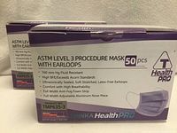 Front of both Thinka Health PRO Level 3 mask boxes showing specifications and 50 pcs count