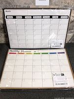 Both packaged dry erase calendar boards front view