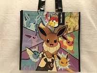 Front view of tote bag showing Eevee and evolutions graphic