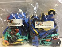 Two clear bags filled with assorted colorful magnetic foam letters and numbers, WonderFoam labels visible