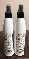 Front view of both Salon Pet conditioner bottles