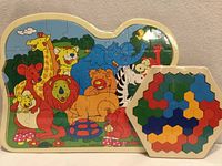 Zoo animals wooden jigsaw and hexagon puzzle side by side