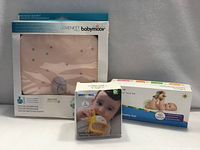 All three boxed baby items front view