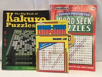 Front covers of three puzzle books
