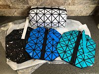 Group shot of all four geometric pouches