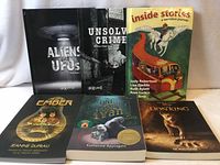 Six books standing and lying for full lot overview