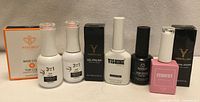 Front view of all nine gel nail products showing branding and packaging