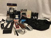Group shot of all men’s grooming items, swim brief and accessories