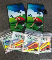 Full lot view showing two pouches and four packs of tees