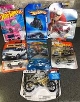 All seven packaged die-cast vehicles displayed