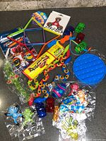 Group shot of all packaged fidget and novelty toys on countertop