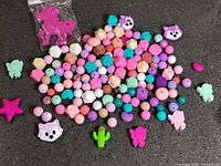 Overview of entire lot of multicolour silicone beads spread on surface