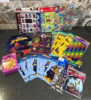 All sticker packs and sheets laid out on countertop