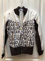 Front view of LPGA brown and white zip-up sweater jacket