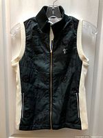 Front view of LPGA sleeveless quilted vest showing colour scheme, zipper, collar and pockets