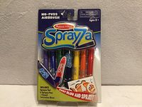 Front view of sealed Sprayza kit showing pens and tool