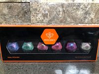 Front of sealed Modelones Pearl Nail Polish box showing six colours