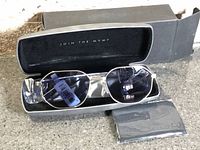 Sunglasses in MVMT hard case with outer box and cloth
