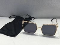 Front view of sunglasses with pouch