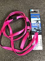 Full view of pink Rogz leash with retail tag