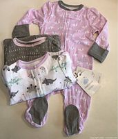 Three Cloud Island sleepers stacked, tag visible