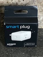 Front of sealed retail box showing Amazon Smart Plug