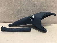 Funnel and extension tube laid out on white surface