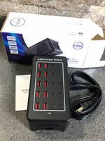 Charging station, power cord, manual and box