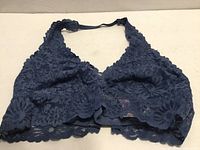 Front view of blue lace bralette