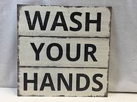 Front view showing "WASH YOUR HANDS" text and distressed finish