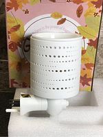 Overall view of white ceramic plug-in wax melt warmer and box