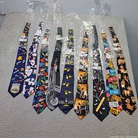 All nine novelty ties laid out in plastic