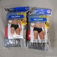 Front view of two sealed Gildan value packs of men’s briefs