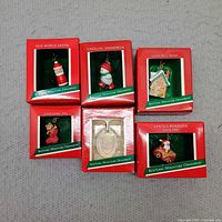 All six boxed Hallmark miniature ornaments front view